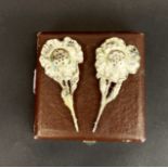 An unusual pair of cased Art Nouveau silver plated pepper shakers in the form of flowers, L. 10cm.