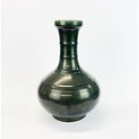 A Chinese green glazed ribbed porcelain vase, H. 33cm.