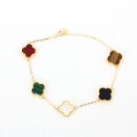 An 18ct yellow gold bracelet set with tiger's eye, malachite, onyx, carnelian and mother of pearl,