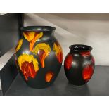 Two Poole pottery vases, largest H. 24cm.