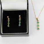 A 9ct gold emerald and diamond set pendant on a 9ct gold chain, L. 45cm, together with a pair of