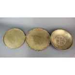 Three early 20th Century Chinese brass trays/dishes, largest Dia. 29cm.