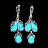 A pair of 925 silver drop earrings set with cabochon cut turquoise and marcasite, L. 4.5cm.