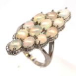 A 925 silver ring set with cabochon cut opals and white stones, L. 3cm, (N.5).