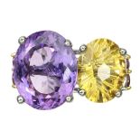 A 925 silver ring set with a large concave oval cut amethyst and citrine, and rubies, (O).