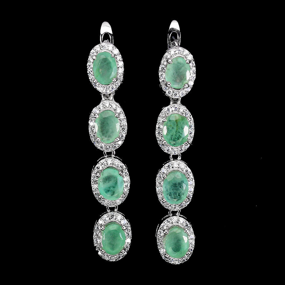 A pair of 925 silver drop earrings set with oval cut emeralds and white stones, L. 3.7cm.