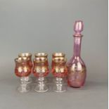 A gilt decorated Bohemian glass decanter and six goblets, goblet H. 15cm.