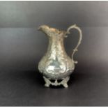 A Victorian hallmarked silver milk jug, H. 16cm.