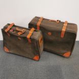 A Bric's Italian olive green and tan leather suitcase together with a further matching suitcase...