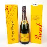 Two boxed bottles of Veuve Clicquot champagne. Together with a further unboxed bottle.