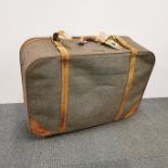 A vintage style canvas and leather suitcase 75 x 50 x 25cm.