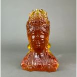 A Chinese reconstituted amber bust of a Buddhist goddess, H. 19cm.