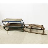 A pair of iron and wood sleds together with a further wooden sled, largest 95 x 40cm.