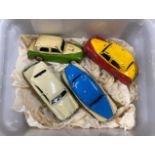 Four Dinky diecast model vehicles.