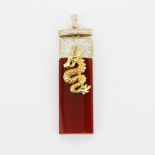 A 14ct yellow gold and carnelian Chinese pendant set with diamonds, L. 4.5cm.