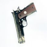 A replica Colt gold cut government model .45 automatic pistol.