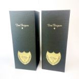 Two cased bottles of Dom Perignon 2008 and 2009 champagne.