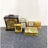 A gilt brass carriage clock with a 1970's desk clock, etc.