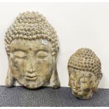 A wall mounted large stone textured fibre glass Buddha head, H. 58cm, together with a further