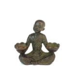 A small Chinese cast bronze figure of a young monk, H. 6cm.