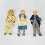 A group of three early dressed lead dolls, H. 9cm.