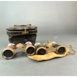 Two pairs of antique opera glasses.