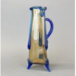 A large unusual hand-made glass triangular jug with ground pontil mark, H. 36cm.