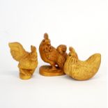 Two carved fruitwood netsuke of chickens and one further carving, tallest 5.5cm.