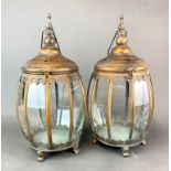 A pair of bronzed metal storm lanterns, H. 49cm.