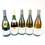 Five bottles of mixed vintage Montrachet wine.