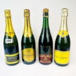 Four mixed bottles of vintage champagne.
