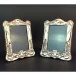 A pair of hallmarked silver fronted Art Nouveau style photograph frames, H. 20cm.