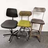 Two industrial revolving workmen's/office chairs and a further industrial metal office chair,