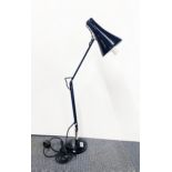 A vintage black anglepoise reading lamp.