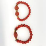 Two old Chinese elasticated cinnabar bracelets.