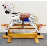 A vintage wooden rocking horse, L. 118cm, H. 90cm.