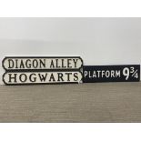 Three Harry Potter related wooden signs, longest 78cm.