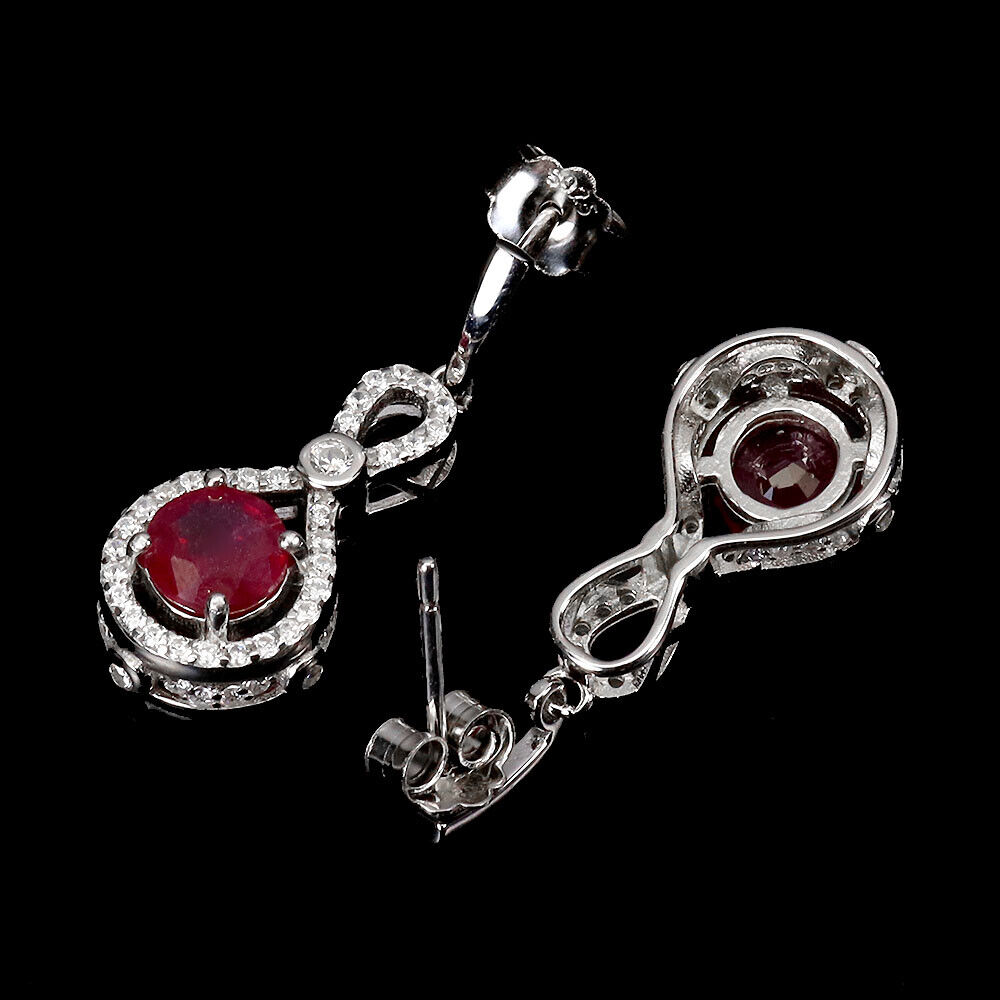 A pair of 925 silver drop earrings set with round cut rubies and white stones, L. 2.9cm. - Image 2 of 2