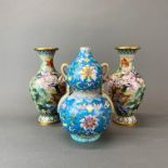 A pair of Chinese cloisonne vases on wooden stands, H. 26cm. together with a hand enamelled