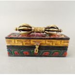 A Tibetan bronze dorje in carved and painted wooden cas, Box 21 x 7 x 7cm.