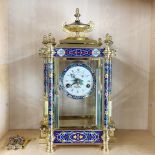 A mercury pendulum enamelled gilt brass striking mantel clock, H. 44 cm.