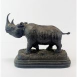A bronze figure of a rhino mounted on a black marble base, after Julie Moigniez. H. 20 cm.