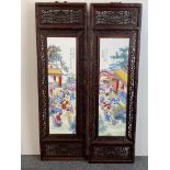 A pair of Chinese hand enamelled porcelain panels in hardwood frames. H. 120cm. W. 36cm.