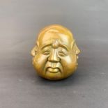 A bronze four faced Buddha desk weight, H. 12cm.