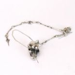 An interesting sterling silver skull and bones watch chain, skull w. 4cm.