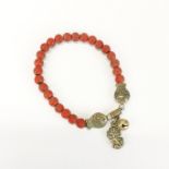 An old Chinese coral and white metal bracelet.