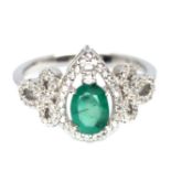 A 925 silver ring set with a pear cut emerald and white stones, (N).