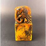 A Chinese carved soapstone seal of an elephant, H. 11cm.