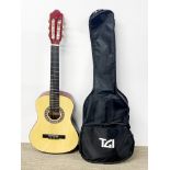 A child's acoustic guitar and case.