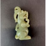 A Chinese jade/hardstone carved figure of a mythical creature, H. 8.5cm.